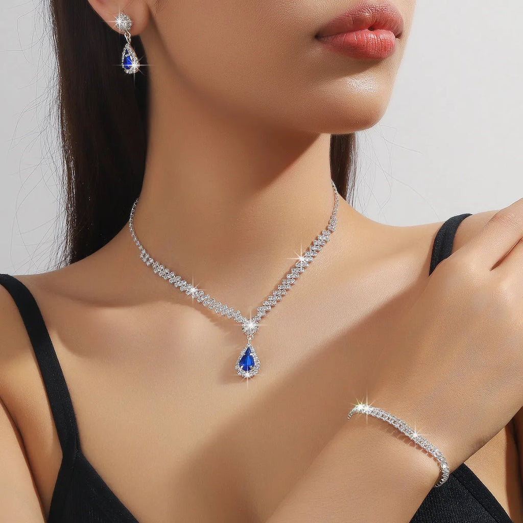 Claw chain necklace and earrings set with rhinestone drop elements in multiple colour options
