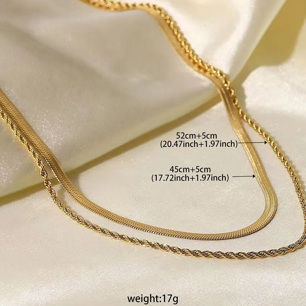 Women's geometric double-layer twist pendant necklace on an adjustable silver snake chain, shown at a mid-length setting.