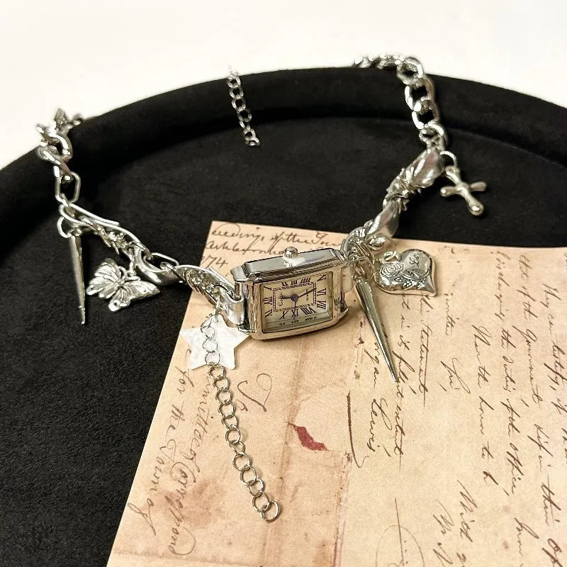 Dark style multi-layer cross necklace with twin clavicle chains showing electroplated alloy construction