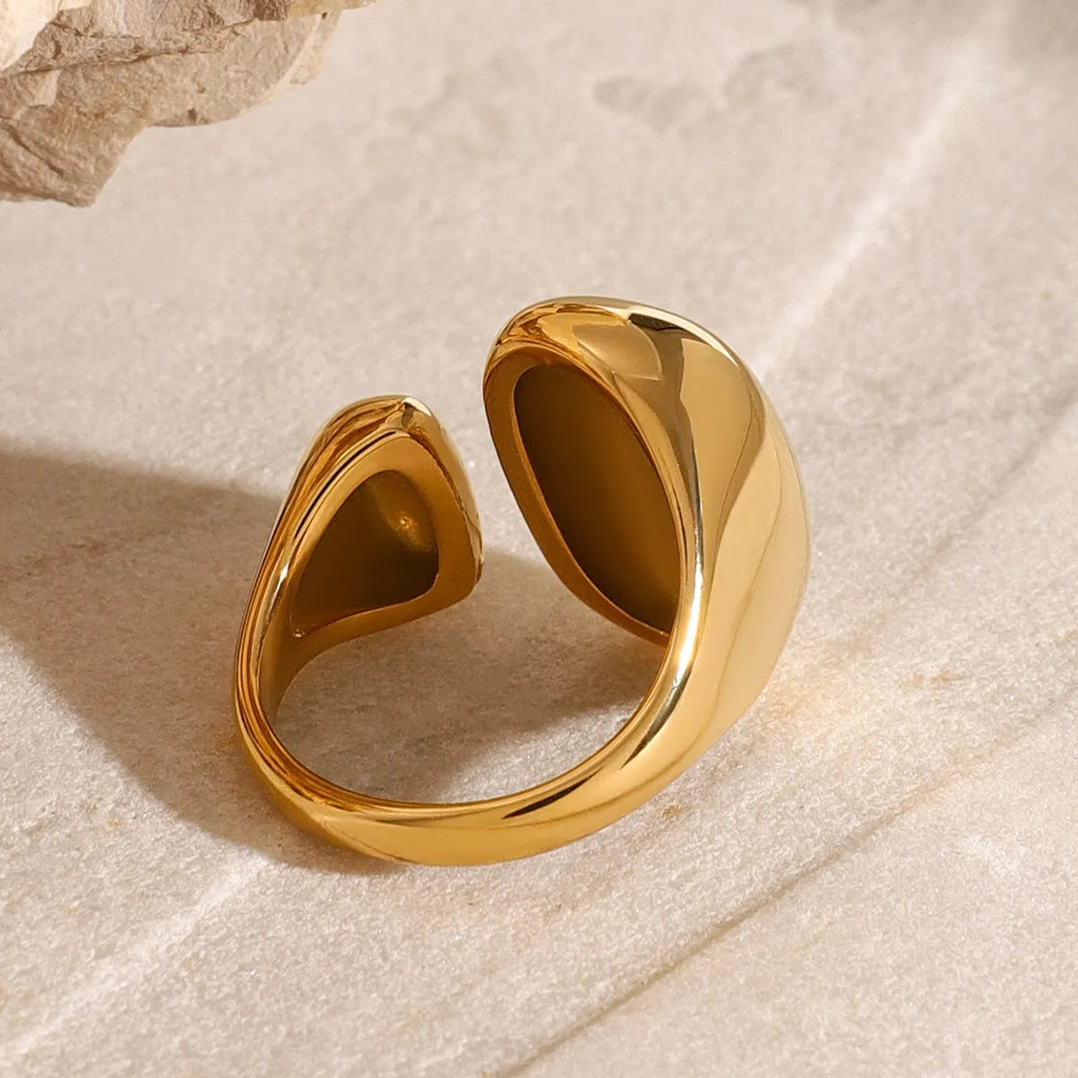 Stainless steel geometric open ring with electroplated metallic finish