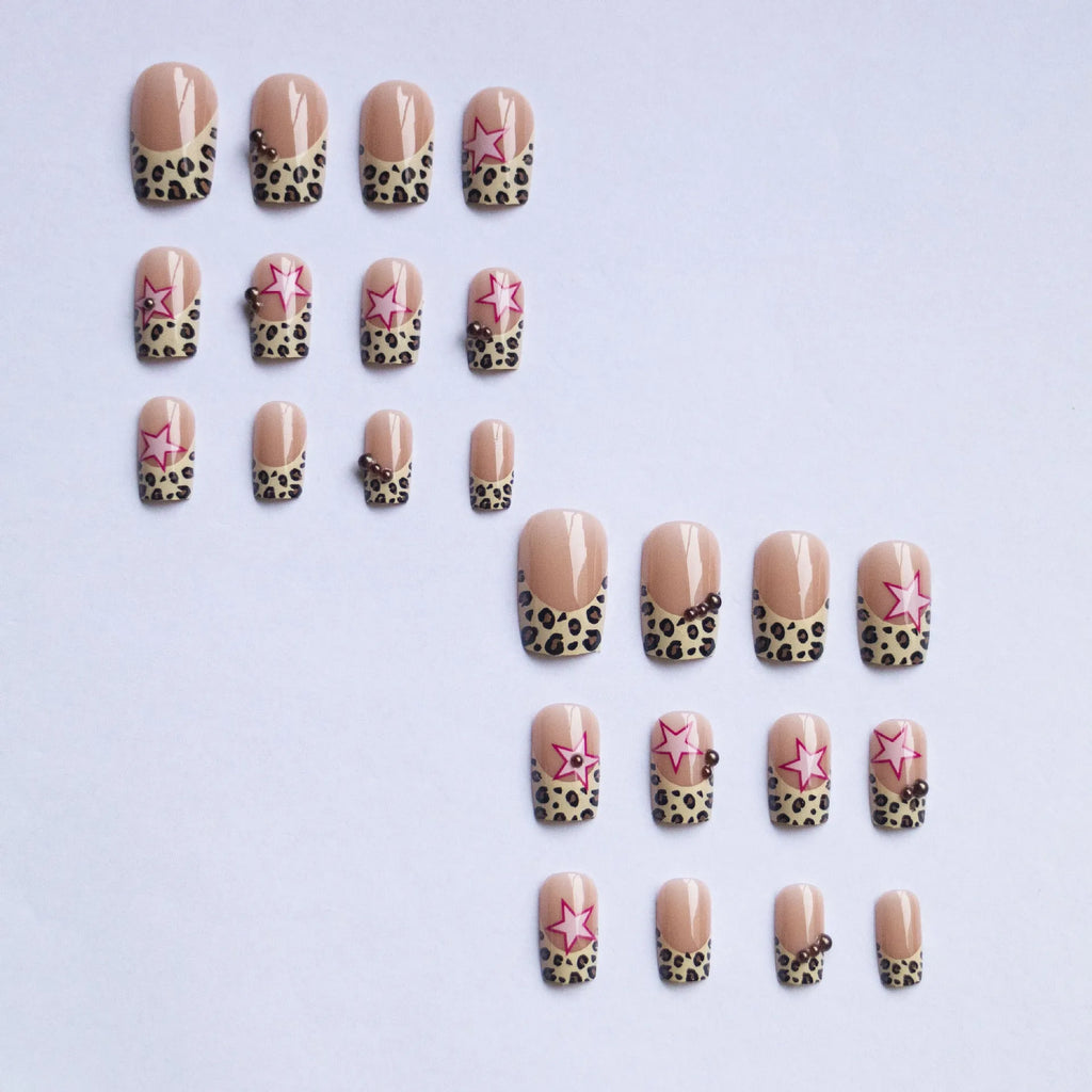 French manicure press on nails with leopard print pattern, star and pearl diamond accents