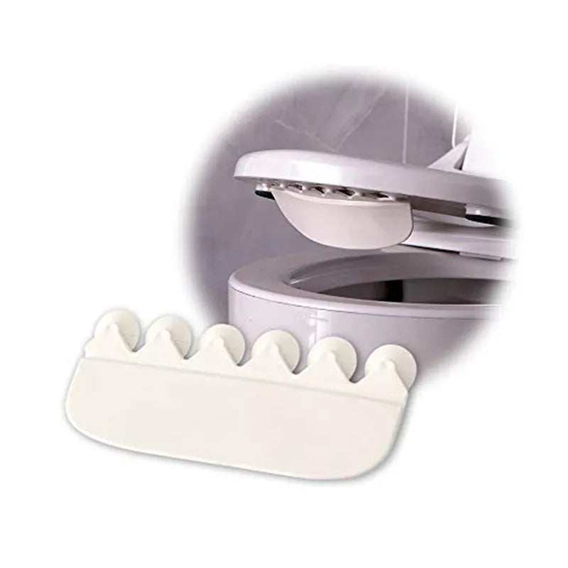 White PVC urine blocking board for children's toilet training placed on standard toilet seat