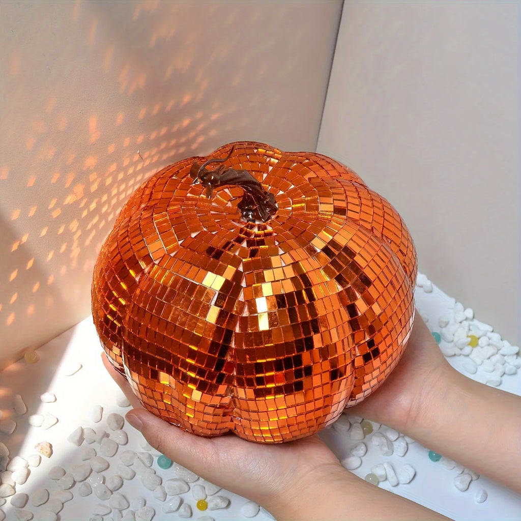 Chinese style glass Halloween pumpkin decoration in five different sizes on a dark surface.