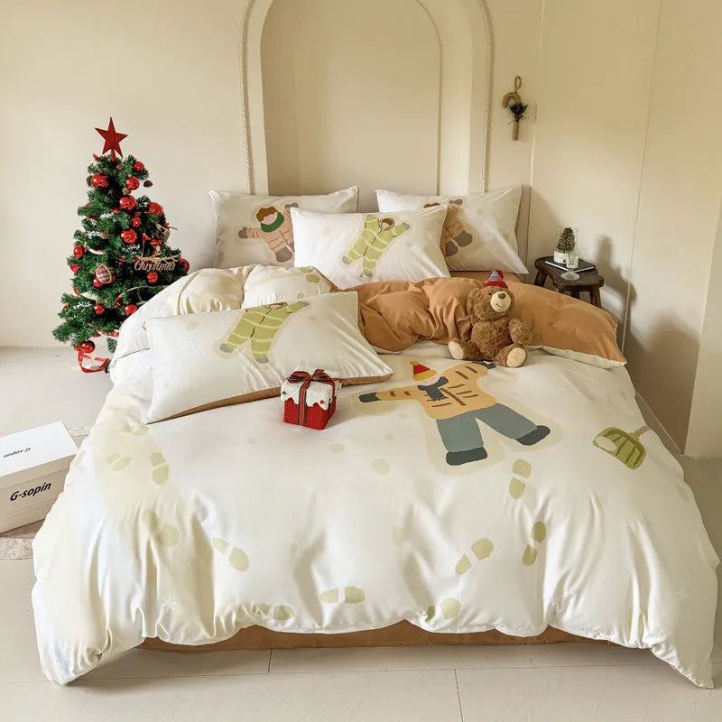Christmas-themed cartoon printed duvet cover and pillowcase set on a bed, showing Gingerbread Man pattern.
