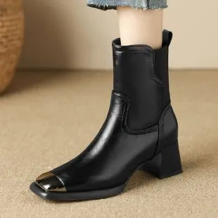 Brown women's knee-high cowhide leather Martin boots with a heel and side zipper detail.