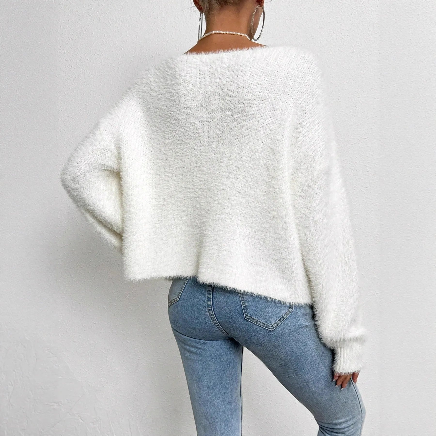 White women's V-neck cardigan sweater with medium thickness and normal length
