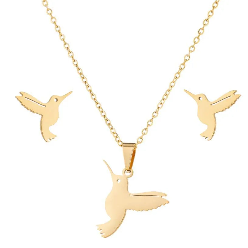 Cute little animal stainless steel jewellery set with bird motif necklace and earrings in gold colour on a white background