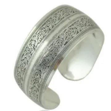 Miao ethnic silver-style bracelet with carved open design in alloy construction