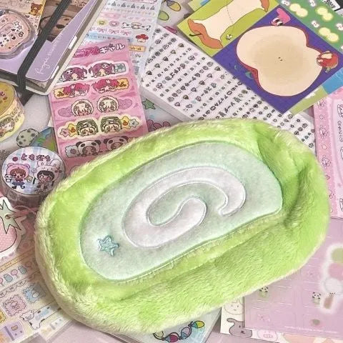 Honeydew Roll plush velvet Swiss roll cake design pencil case for stationery storage.