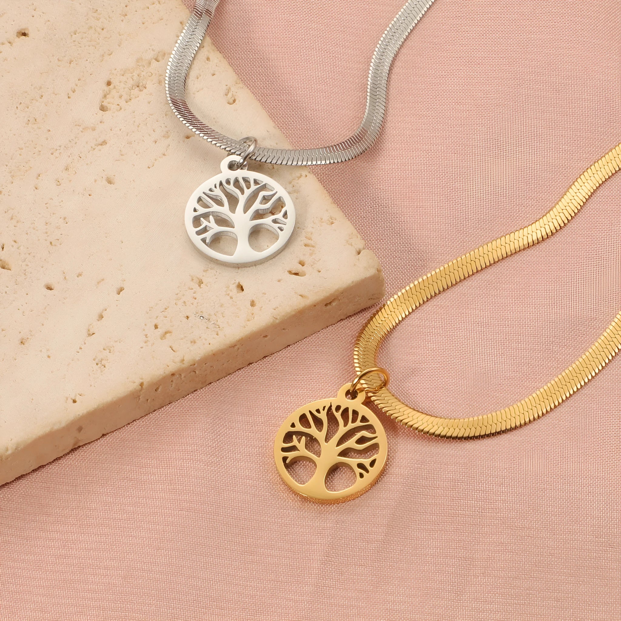 Stainless steel lucky tree necklace with snake bones chain, shown in gold and steel colour options.