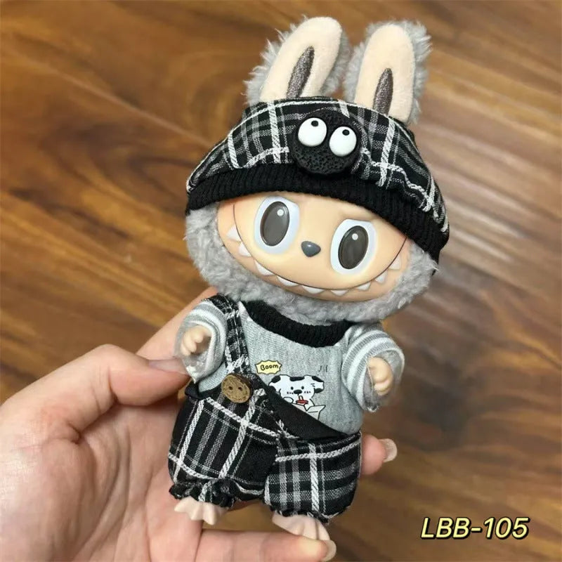 Plastic clothing outfit for a 17cm tall vinyl figure or doll on a display stand.
