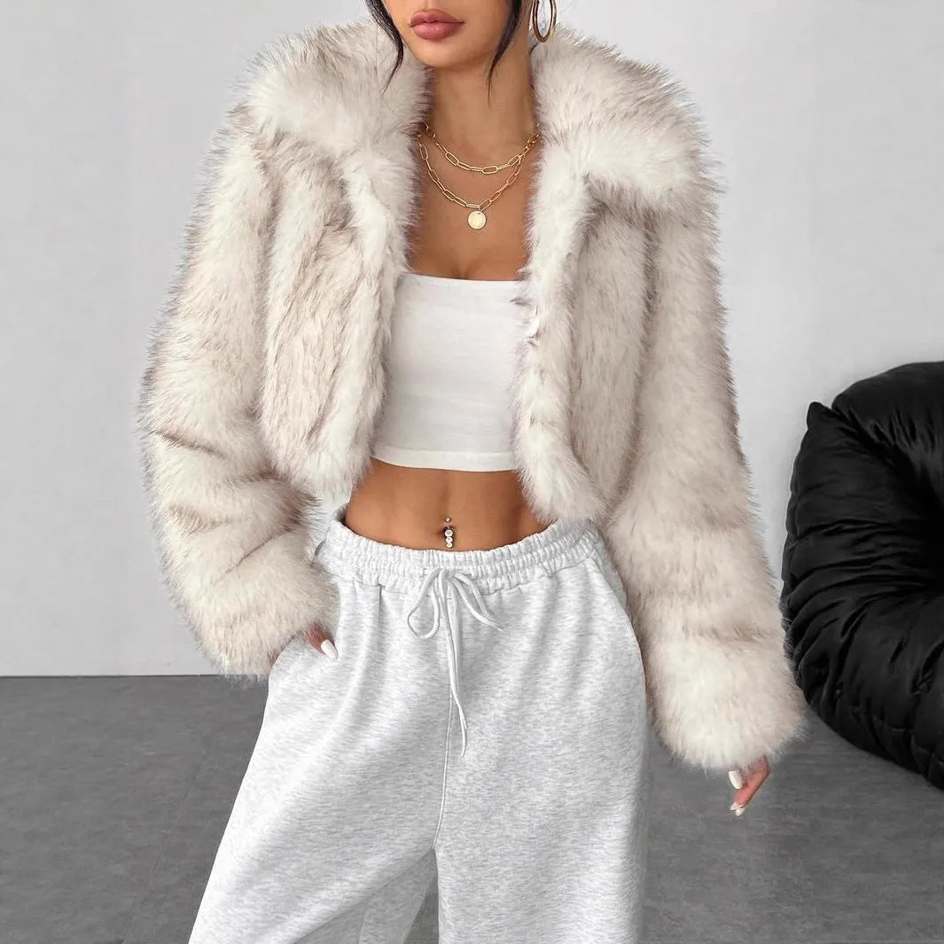Artificial fox fur fashion coat with a fur collar and long sleeves in a short length.