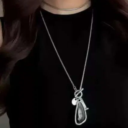 Women's long geometric alloy pendant necklace with snake bone chain, showing blue water drop colour option.