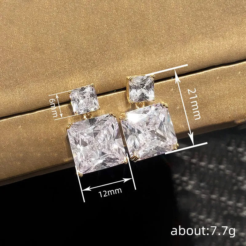 A pair of women's geometric square earrings in copper with a choice of white gold or gold colour finish.