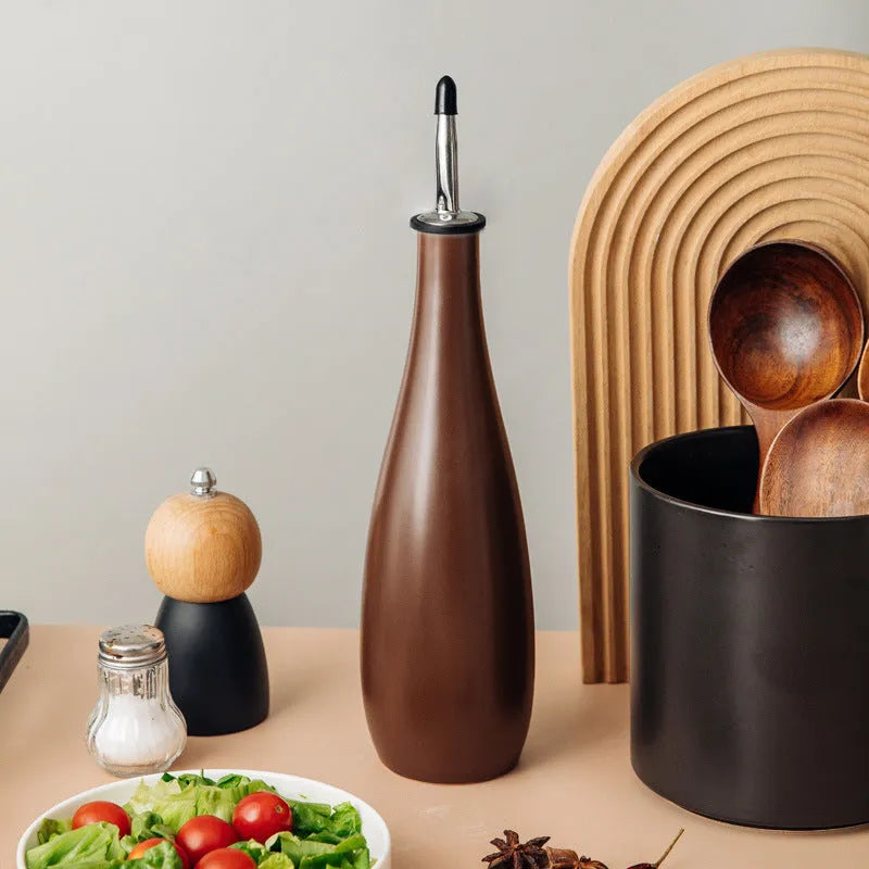 Ceramic kitchen oil pot with funnel and oil brush in black, coffee, or white.