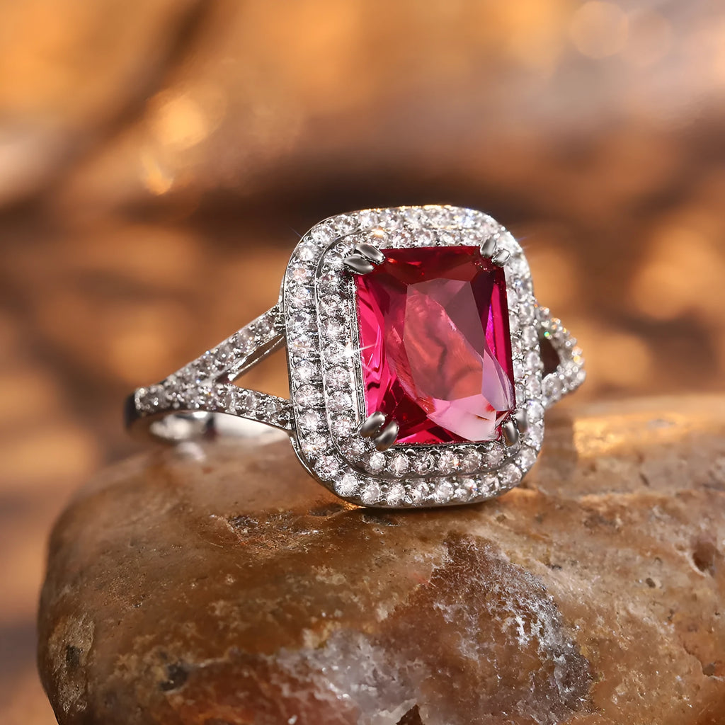 Women's square copper ring with a large red rhinestone set in a geometric princess style.