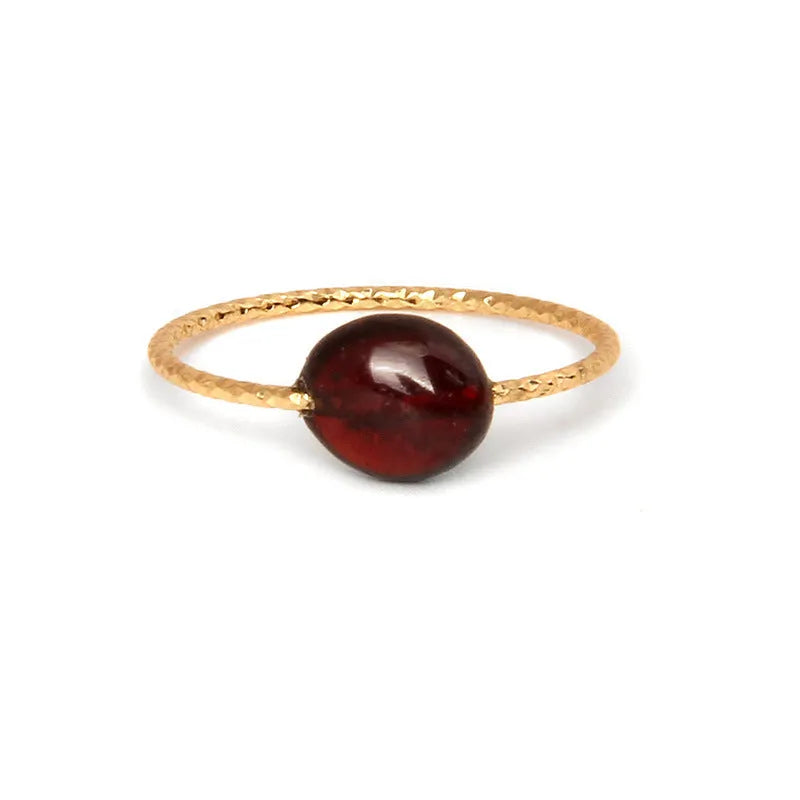 A women's ring featuring a geometric design set with a coloured agate stone.