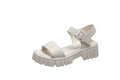 Women's beige peep toe ankle-strap platform sandals with buckle fastening on wooden floor