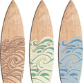 Three natural wooden surfboard wall decorations on a light wall
