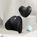 Heart-shaped car pillow in choice of colours, shown as headrest and lumbar support on a car seat.