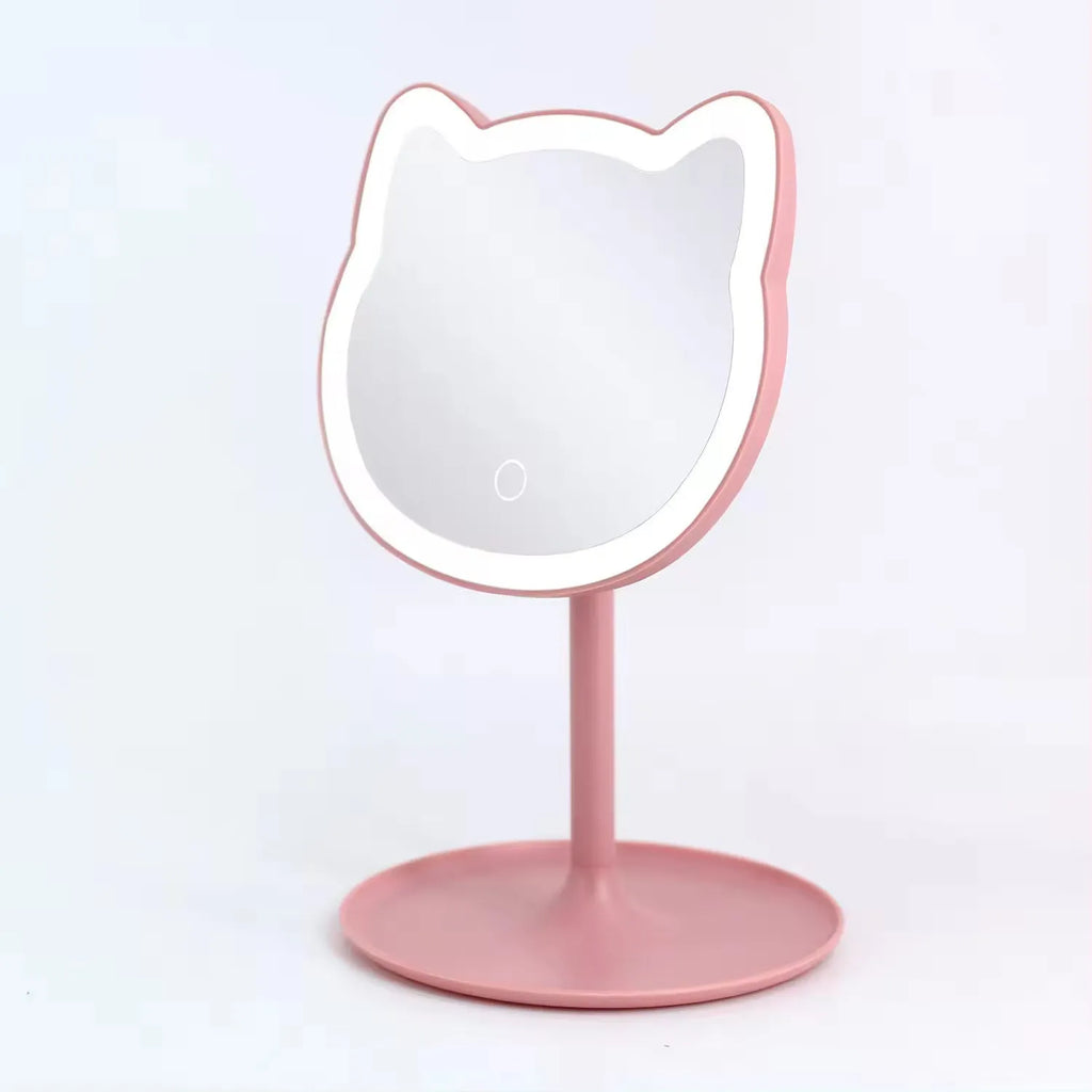 Pink rechargeable makeup mirror with fill light on a desk, ABS frame, aluminium mirror, size 14cm x 18cm