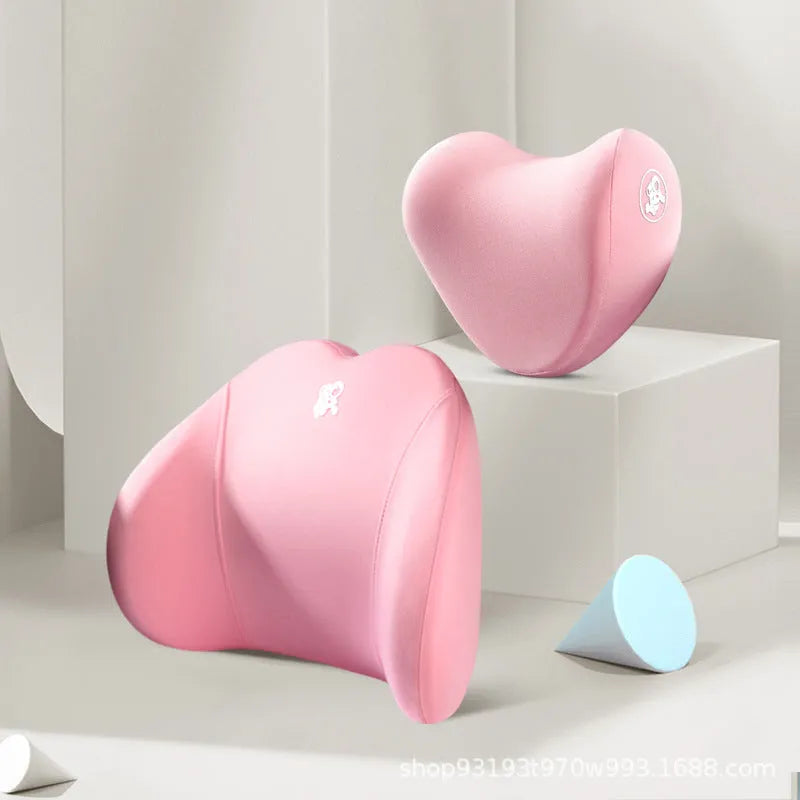 Heart-shaped car pillow in choice of colours, shown as headrest and lumbar support on a car seat.