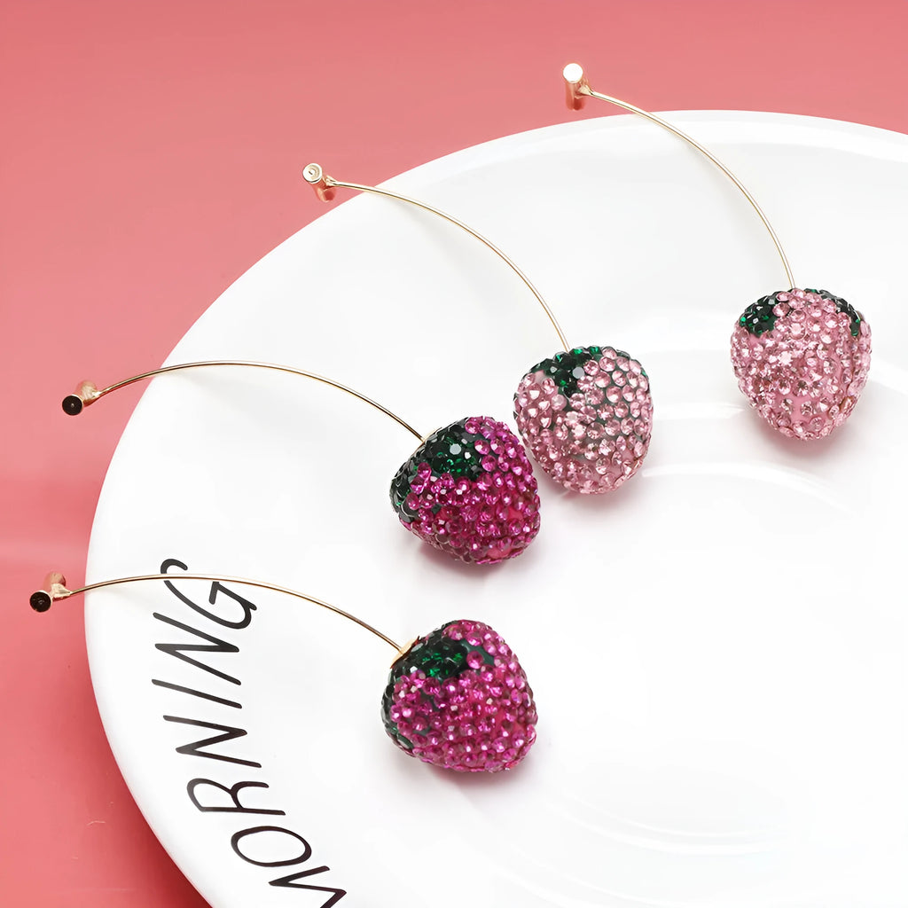 Geometric red strawberry stud earrings with spot-drill texture on a zinc alloy charm.
