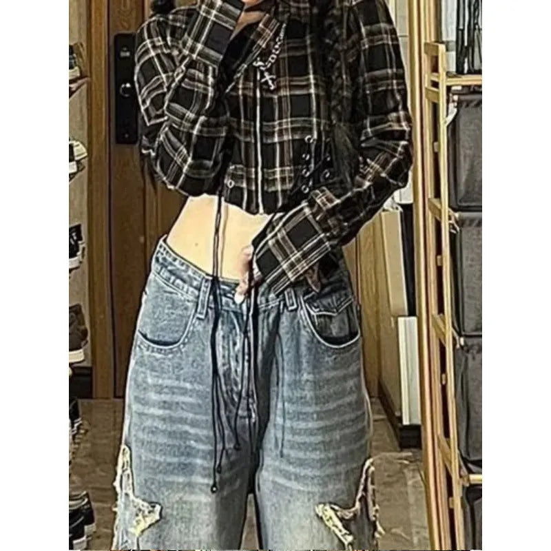 Women's wash blue high-waist straight-leg denim jeans on a hanger.