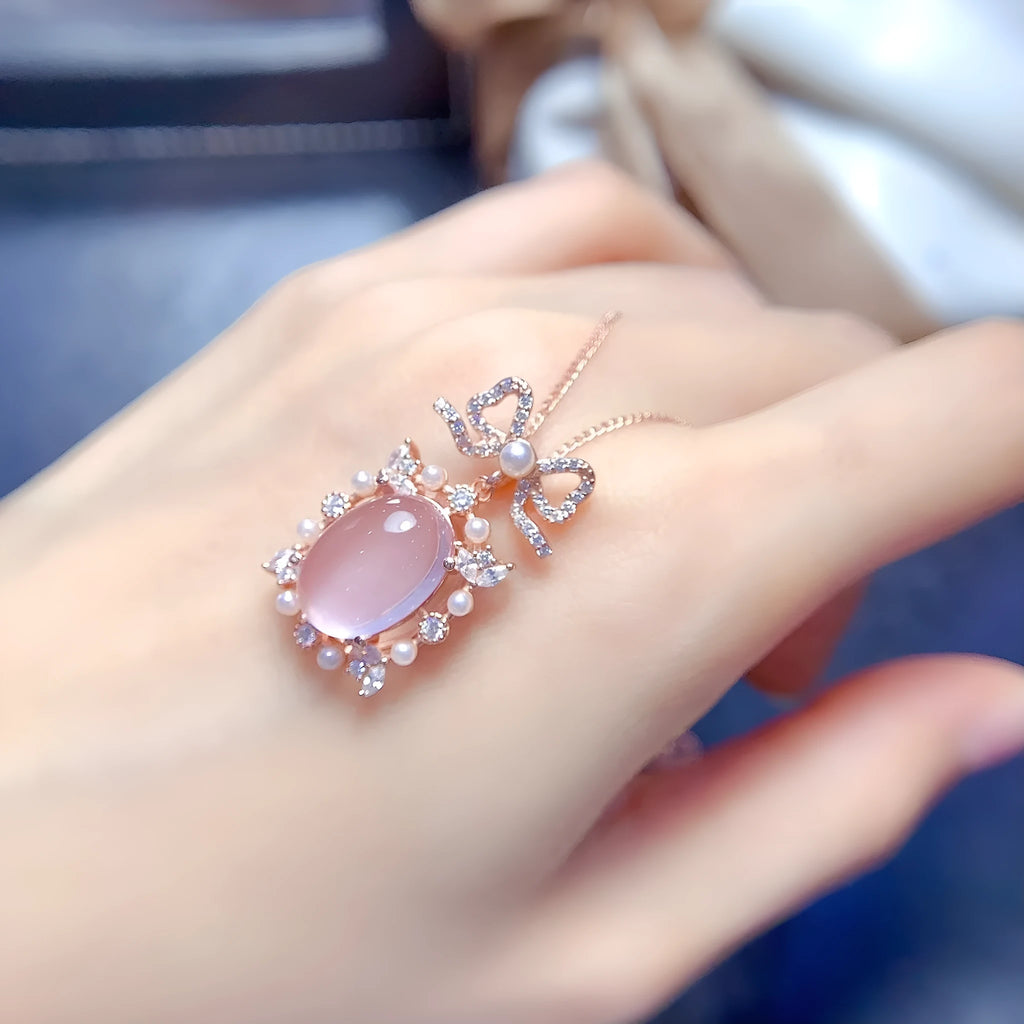 Natural pink rose quartz geometric pendant on a rose gold plated sterling silver necklace.