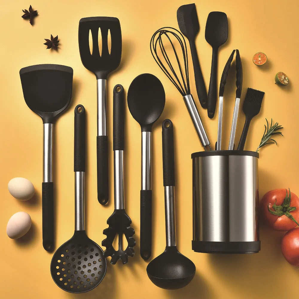 Silicone kitchen utensil set with twelve tools in a rotating white storage caddy on a counter.