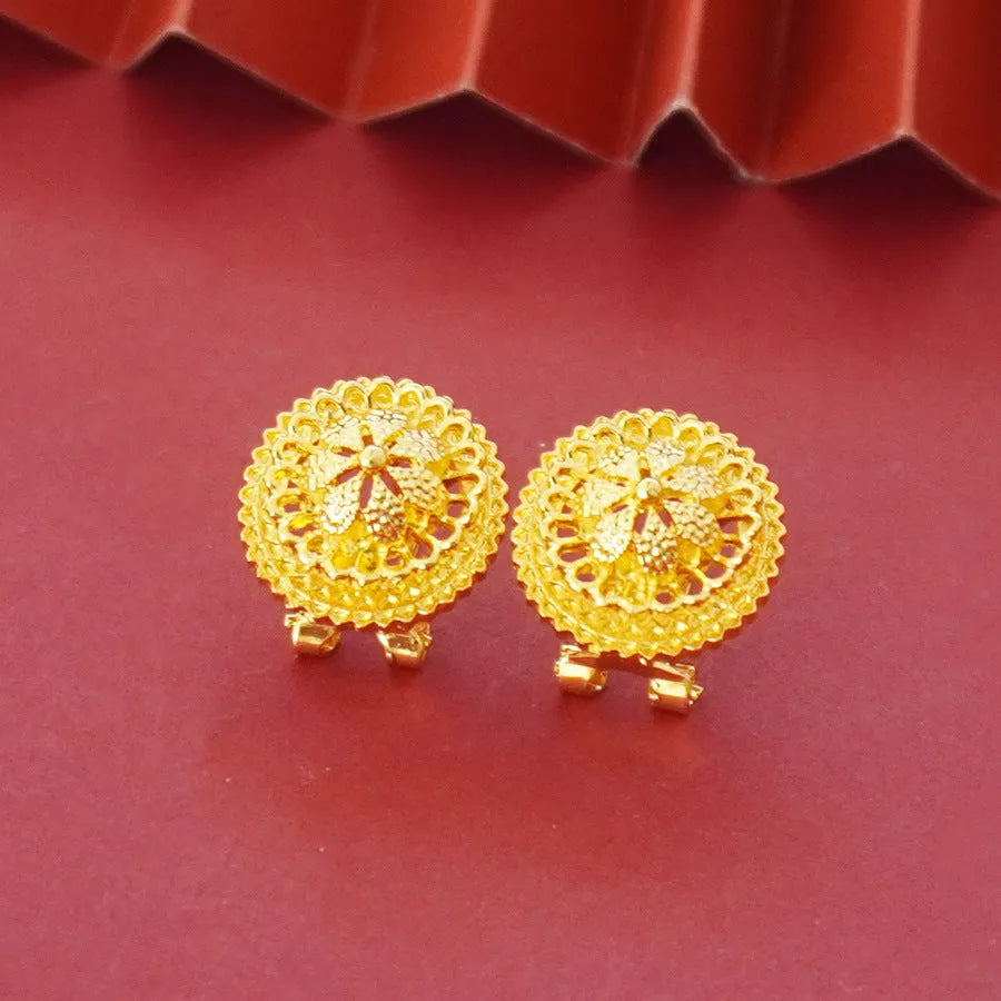 Gold-plated three-piece jewellery set with floral designs showing necklace, earrings, and ring
