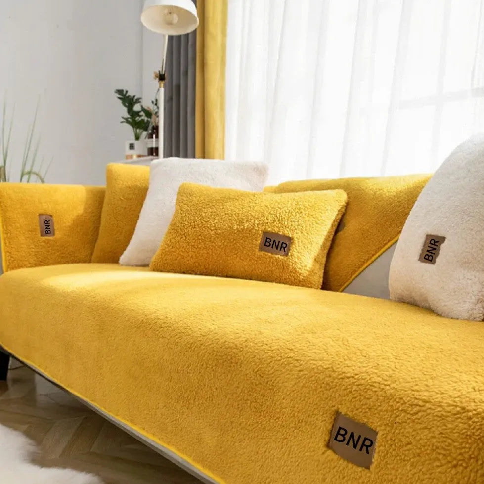 Lambswool sofa slipcover in solid blue colour laid flat, showing its texture and simple design.
