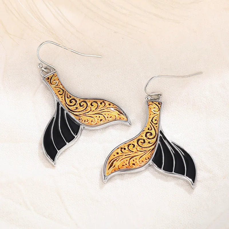 Women's retro whale design fishtail earrings in white gold alloy with distinctive animal-inspired jewellery styling