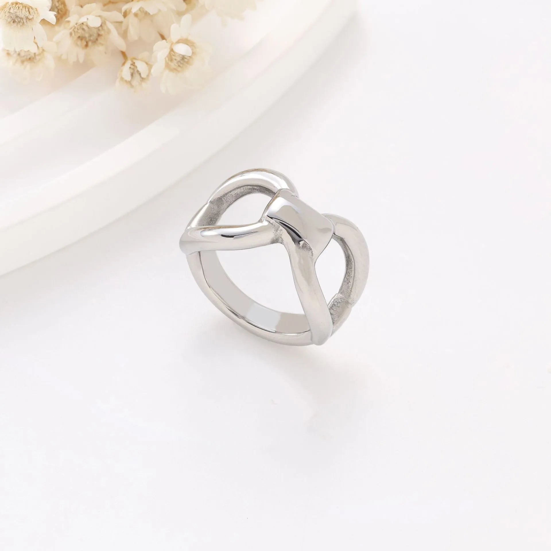 Titanium steel women's ring with hollow butterfly design and geometric bow shape in gold and steel colours