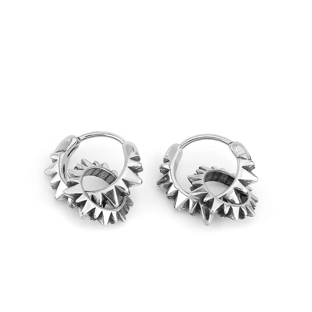 A pair of simple stainless steel round hoop earrings with a polished finish.