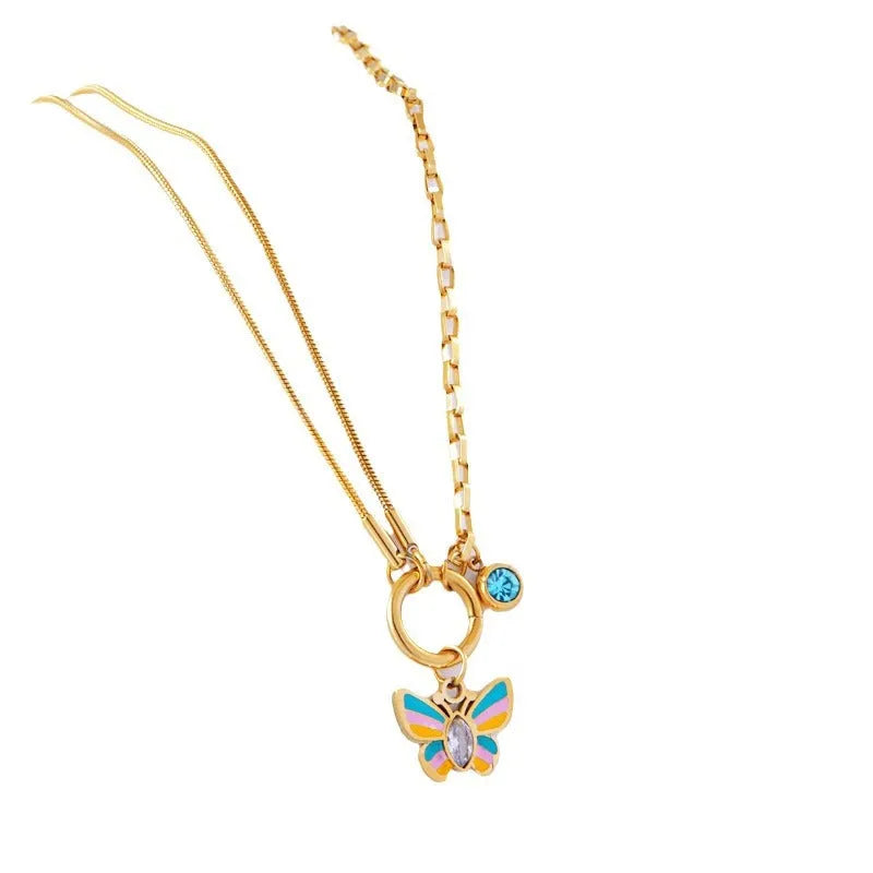 Gold colour titanium steel necklace and bracelet set with a detailed epoxy butterfly charm.