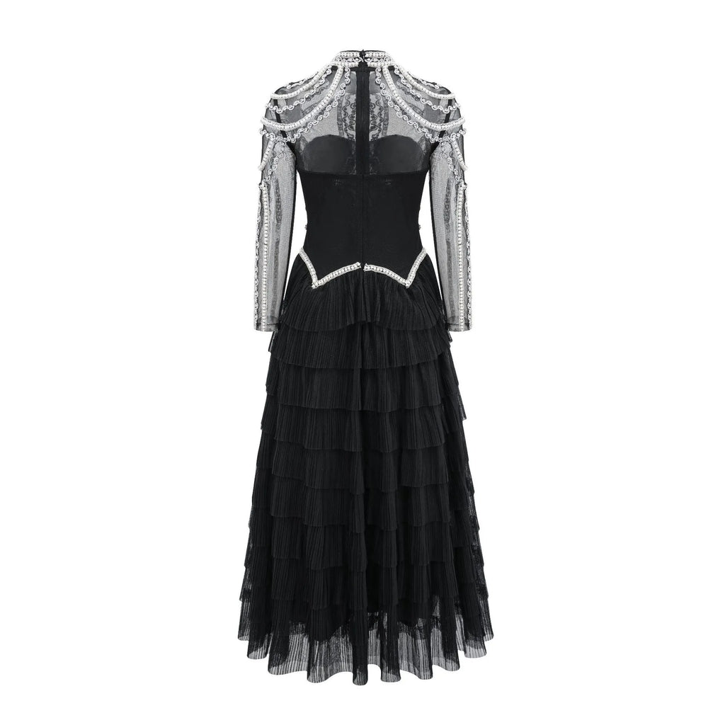 Women's black beaded long sleeve dress with mid-waist design and full-length skirt