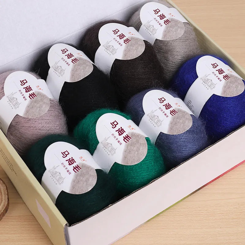 A ball of mohair wool for DIY hand-weaving a scarf in the Inverness thread style, with 34 colour options.