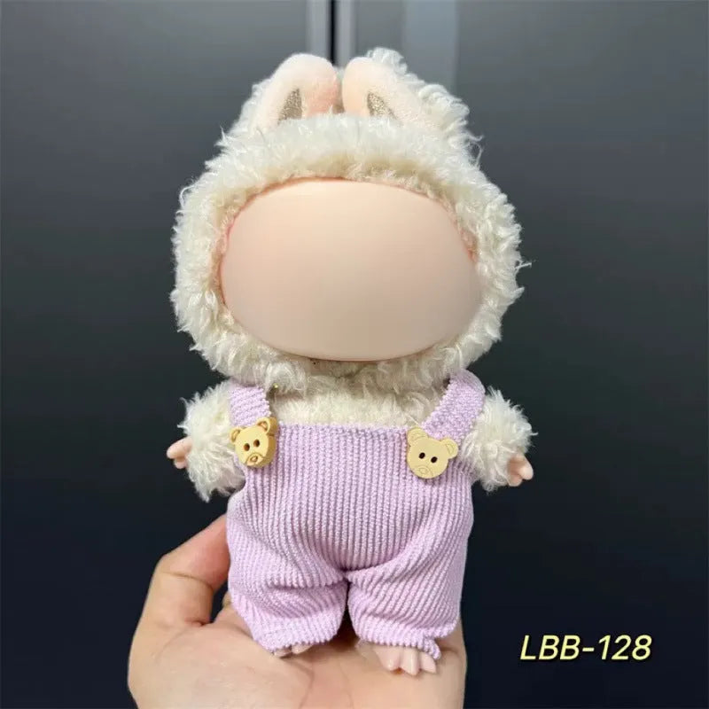 Plastic clothing outfit for a 17cm tall vinyl figure or doll on a display stand.