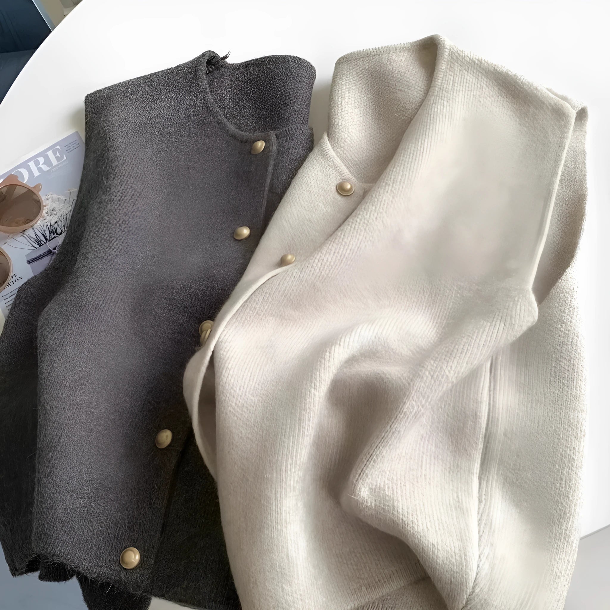 Thin polyester pullover vest with half sleeves in various colours on a hanger