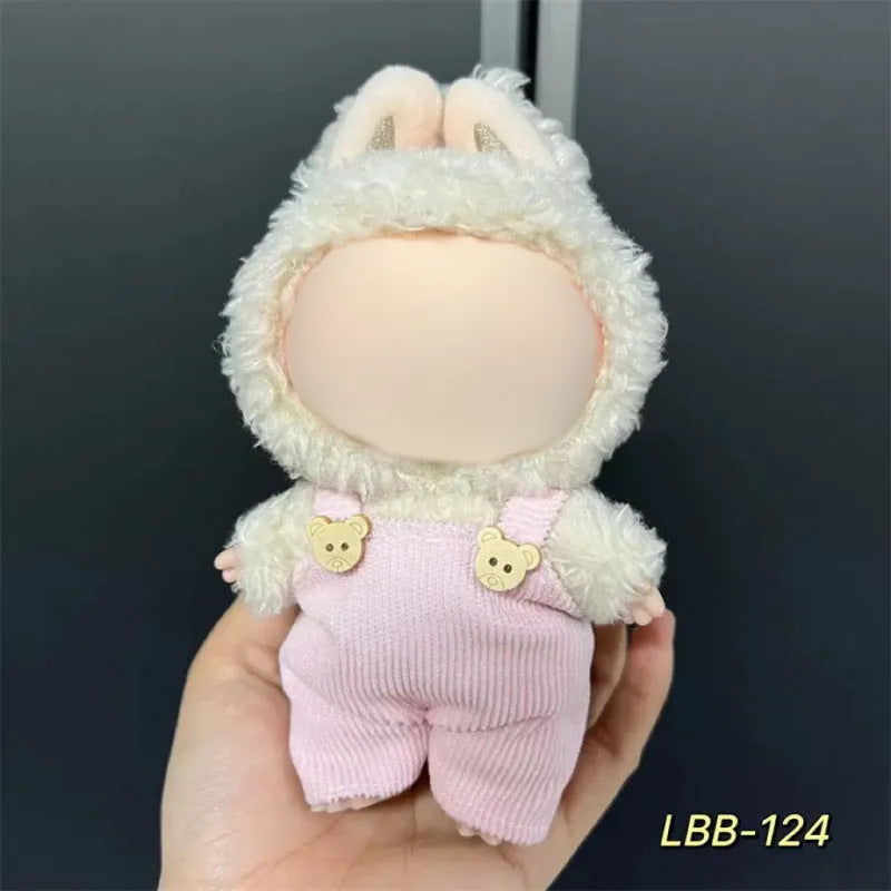 Plastic clothing outfit for a 17cm tall vinyl figure or doll on a display stand.