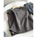 Thin polyester pullover vest with half sleeves in various colours on a hanger