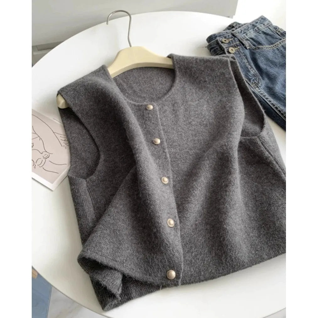 Thin polyester pullover vest with half sleeves in various colours on a hanger