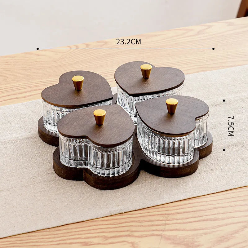 Glass serving platter with heart-shaped lids in a 4-grid configuration on a table