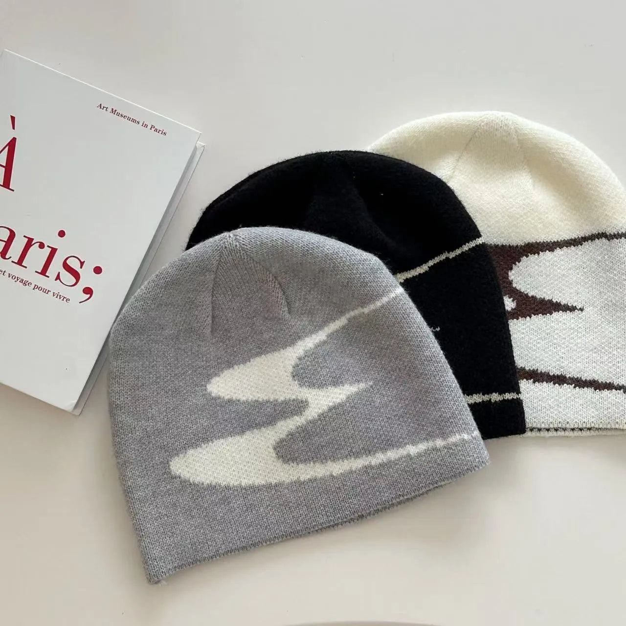 Knitted acrylic beanie hat in black, grey or white colours for autumn and winter wear