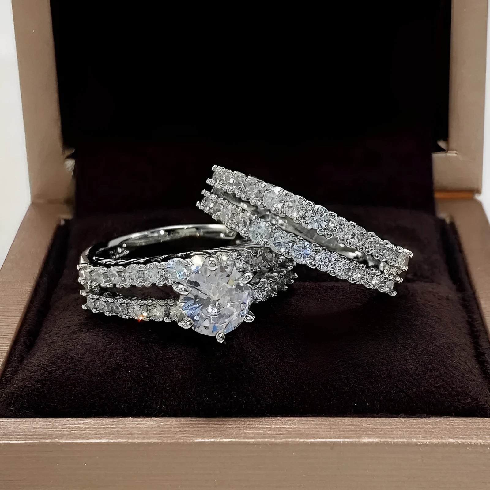 2-in-1 fully-jewelled female ring set in geometric design with round elements, shown in silver, gold and rose gold finishes