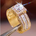 Close-up of a geometric round silver-tone women's ring with a polished electroplated finish, shown in gold and white colour options.