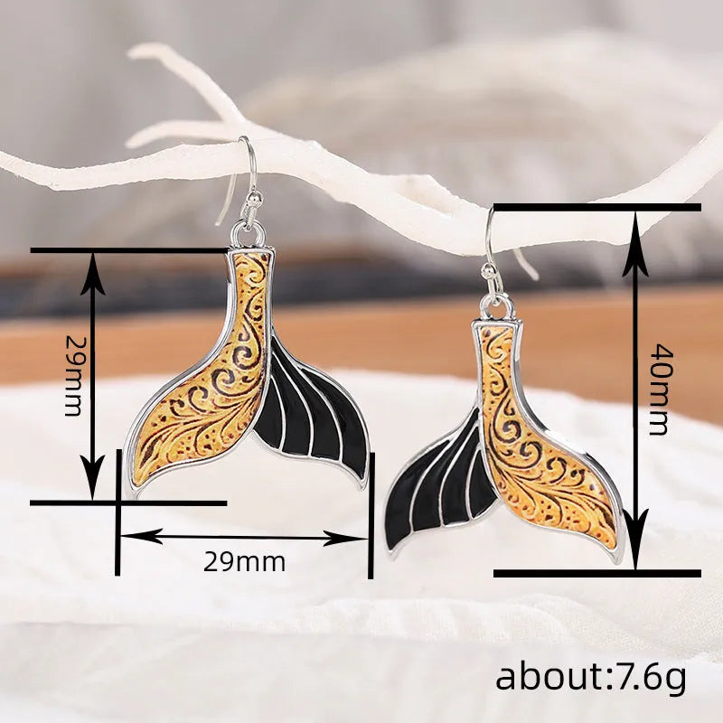 Women's retro whale design fishtail earrings in white gold alloy with distinctive animal-inspired jewellery styling