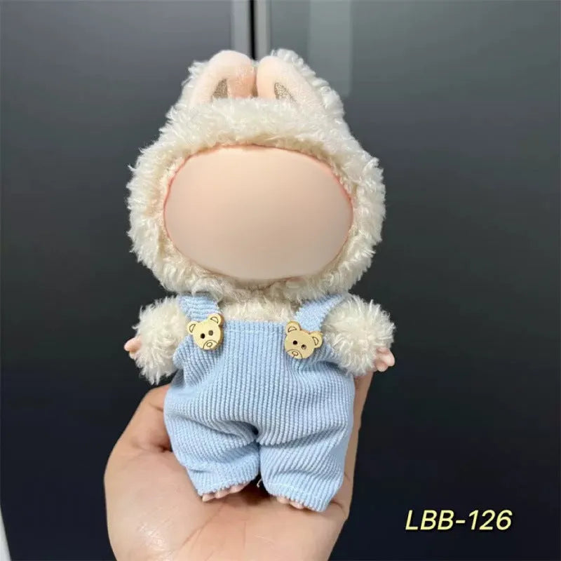 Plastic clothing outfit for a 17cm tall vinyl figure or doll on a display stand.