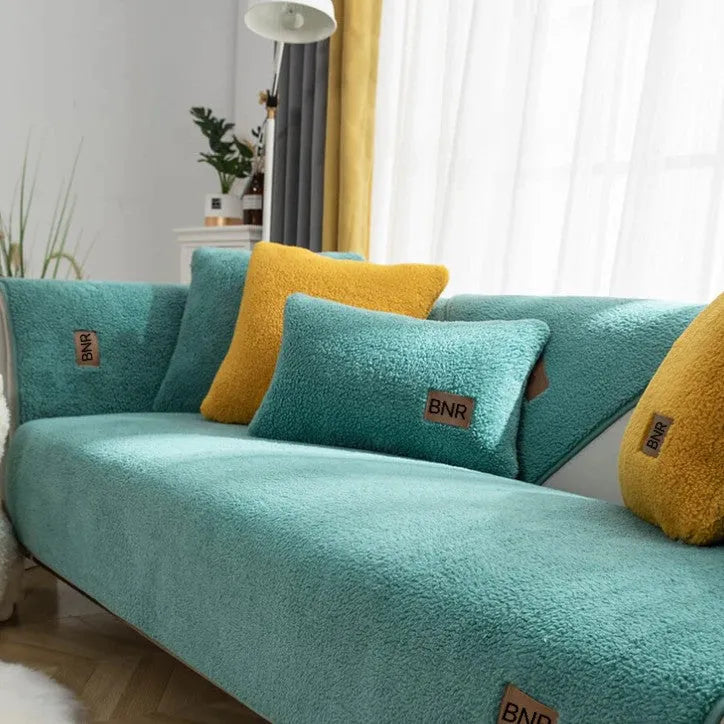 Lambswool sofa slipcover in solid blue colour laid flat, showing its texture and simple design.